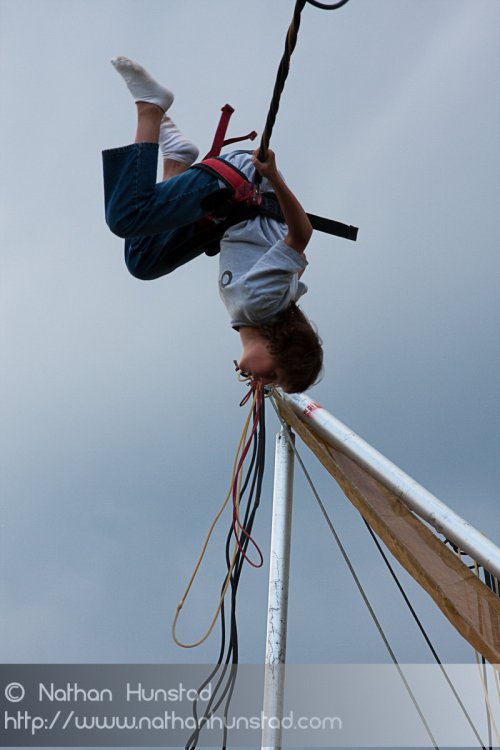 A kid having fun on the bungee jump at the Colorado Irish Festival